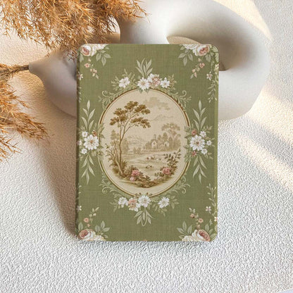 Decorative kindle case with floral and landscape design on a textured surface.