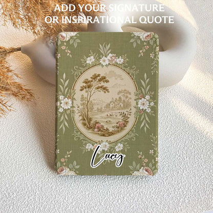 Decorative kindle case with floral design and 'Lucy' on a textured surface