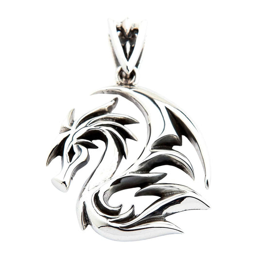An angled view of the gothic tribal dragon pendant, highlighting its high-polish finish.