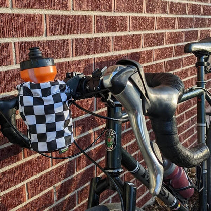 Checkered water bottle holder on drop bar bike