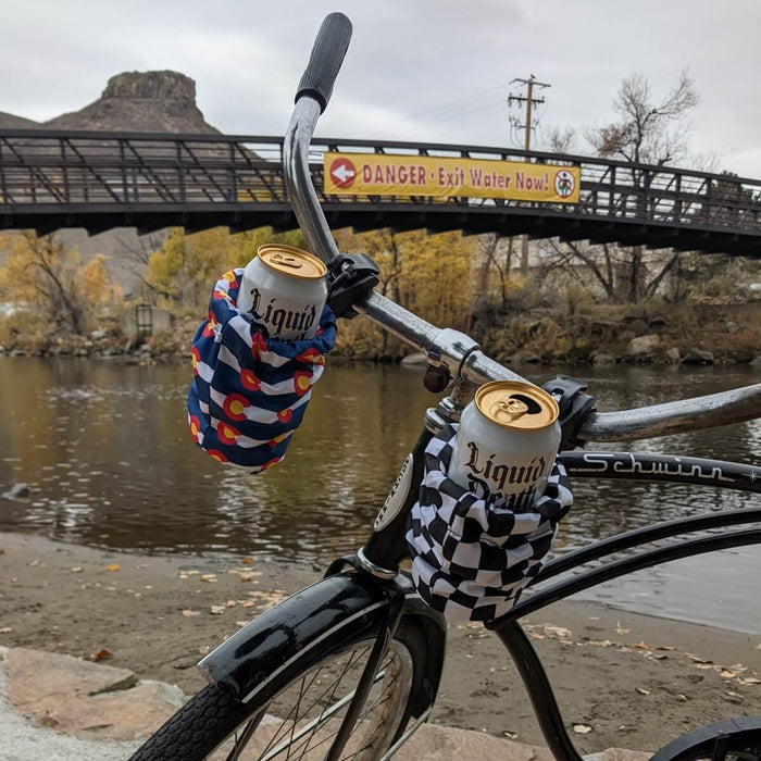 two cup holders on cruiser bike with mountain and river background