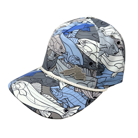 Blue Cap with fish all over pattern with a small silver embroidered patch in the corner.