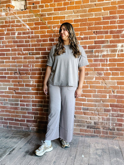 Mocha-colored mineral wash tee with a relaxed, oversized fit and raw edge details.